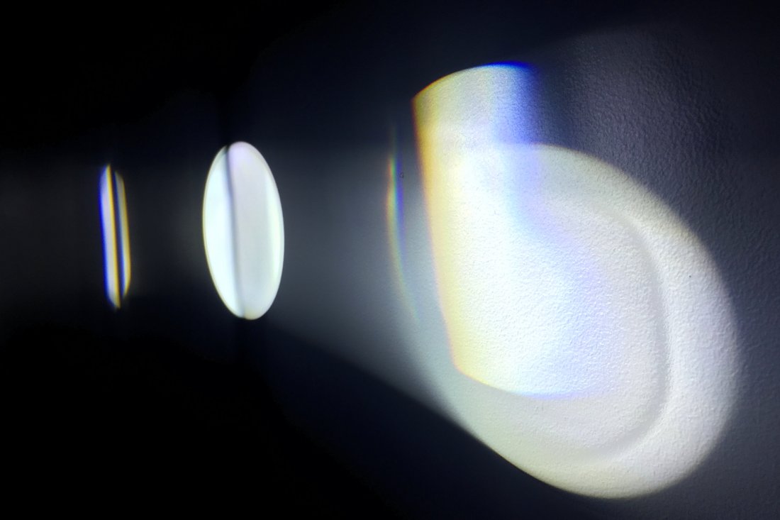 Michaela Gleave, Eclipse Machine (Retograde Motion), 2015, projection lamp, motors, prisms, timber, stand, 70 x 70 x 140cm