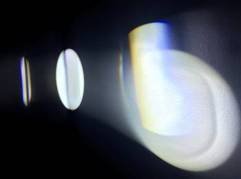 Michaela Gleave, Eclipse Machine (Retograde Motion), 2015, projection lamp, motors, prisms, timber, stand, 70 x 70 x 140cm